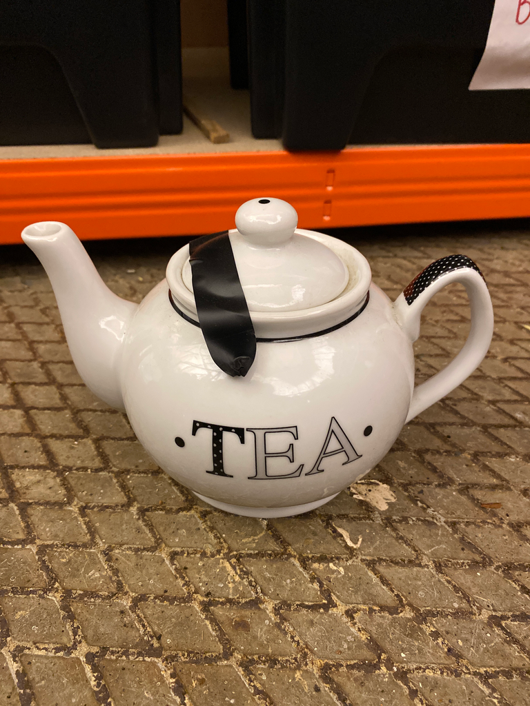 White porcelain teapot with 'TEA' 