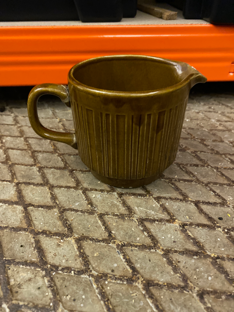 Small brown ceramic pitcher
