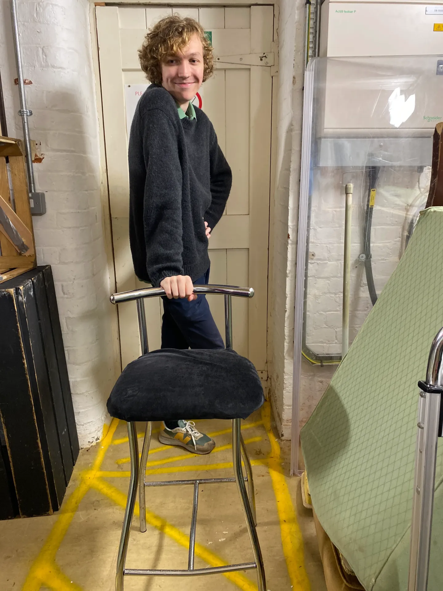 Tall metal chair with black seat