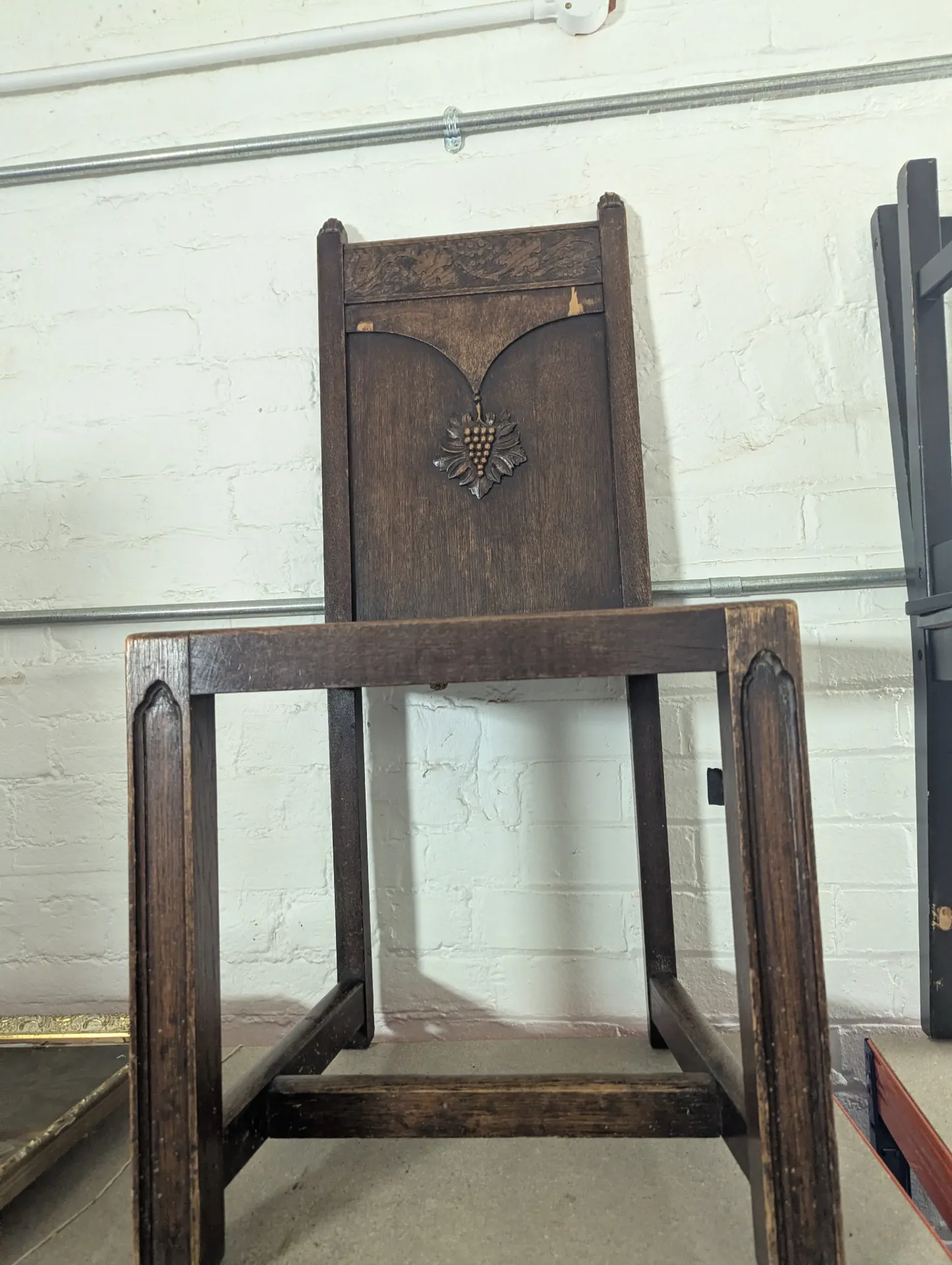 Wooden chair with carved grapes