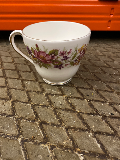 Flared teacup with pink floral pattern