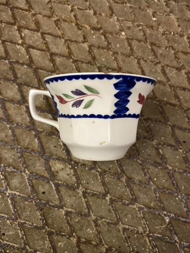 Teacup with blue pattern with leaves 