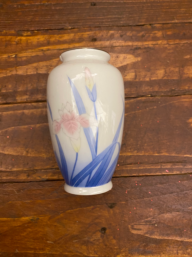 Small white vase with blue flowers