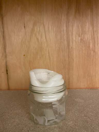 Wax candle in jar